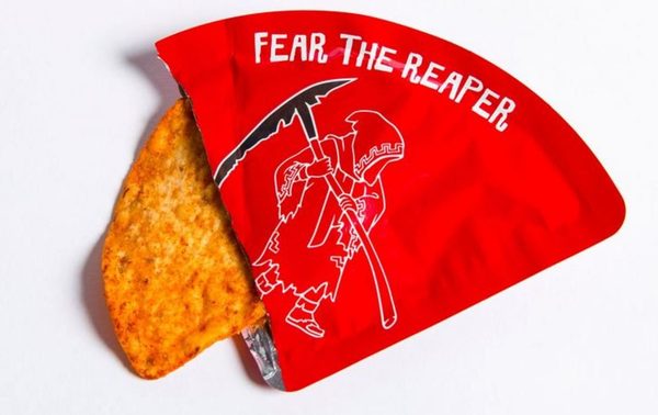 Single Carolina Reaper tortilla chip sold in a coffin shaped box