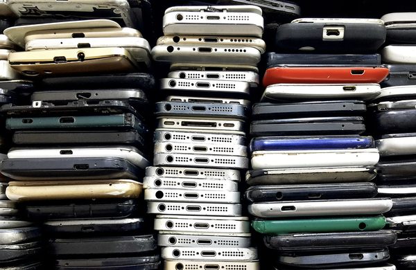 A pile of old mobile phones waiting to be recycled