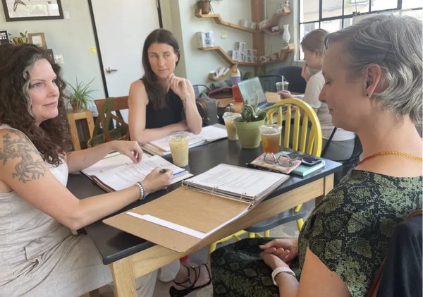 A death doula sitting with a client